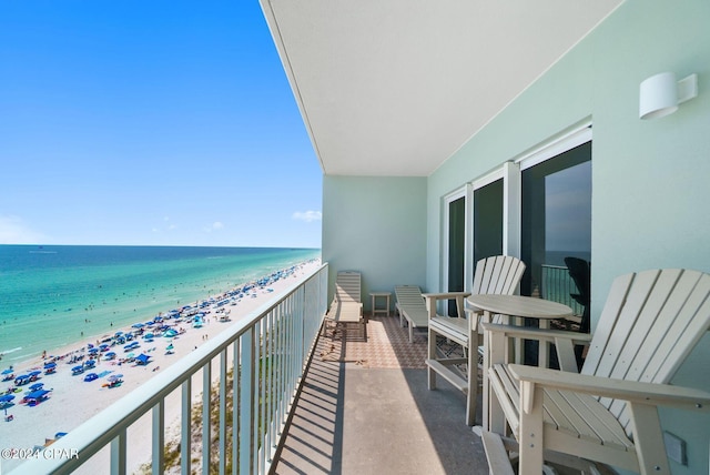 balcony with a beach view and a water view