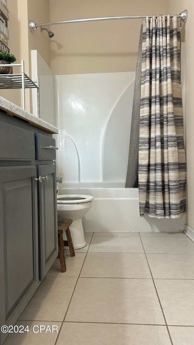 full bathroom featuring shower / tub combo, tile patterned floors, vanity, and toilet