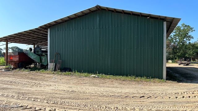 view of side of property featuring a carport