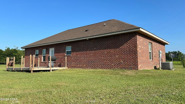 back of property featuring a yard