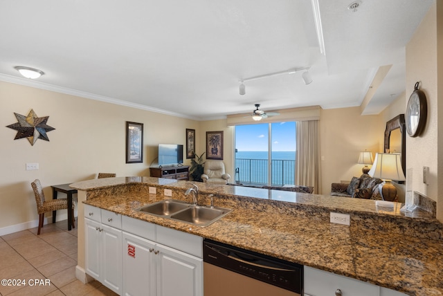 kitchen with light tile patterned floors, dishwasher, sink, ceiling fan, and white cabinets