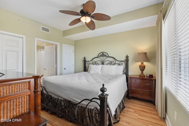 bedroom with ceiling fan and light hardwood / wood-style flooring