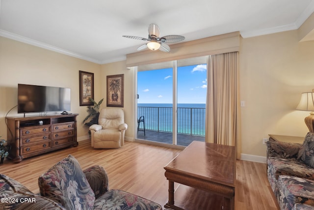 living room with ceiling fan, crown molding, and light hardwood / wood-style flooring