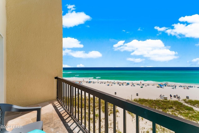 balcony with a beach view and a water view