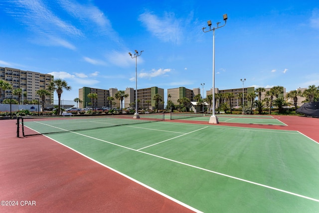 view of sport court with basketball hoop