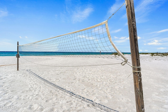 view of community featuring a water view and volleyball court