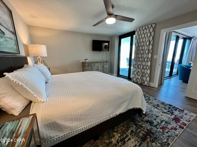 bedroom featuring ceiling fan, access to outside, and wood-type flooring