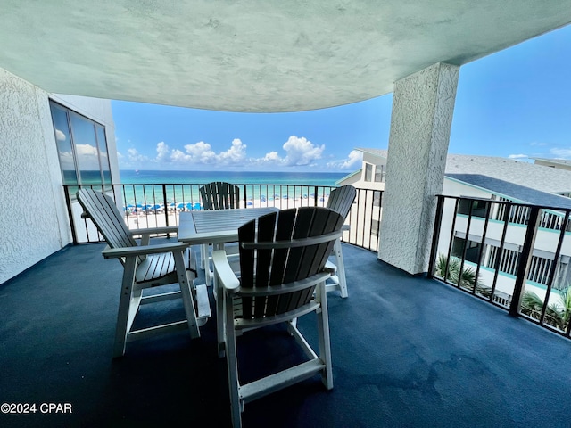 balcony featuring a water view