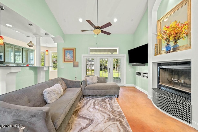 living room with ceiling fan, light carpet, high vaulted ceiling, and french doors