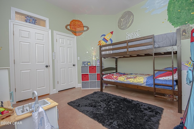 bedroom with concrete floors