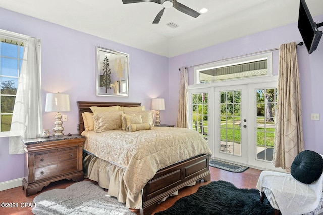 bedroom featuring ceiling fan, dark hardwood / wood-style floors, and access to outside