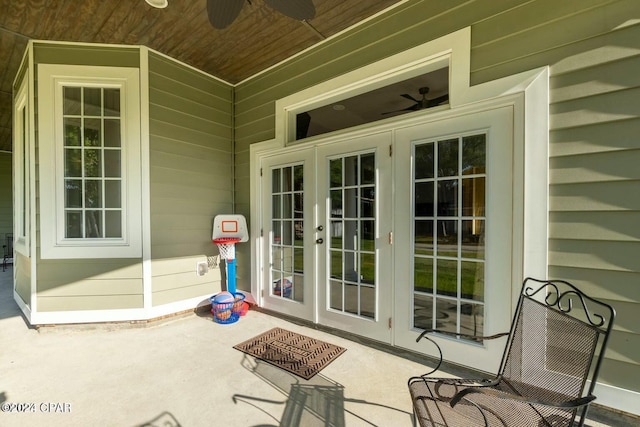 property entrance featuring french doors and ceiling fan