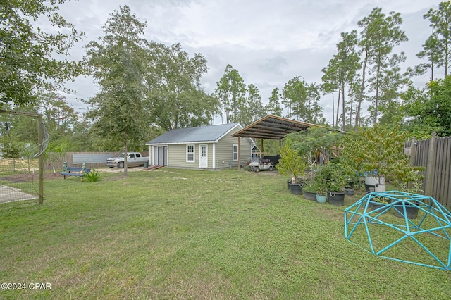 view of yard featuring an outbuilding and a carport