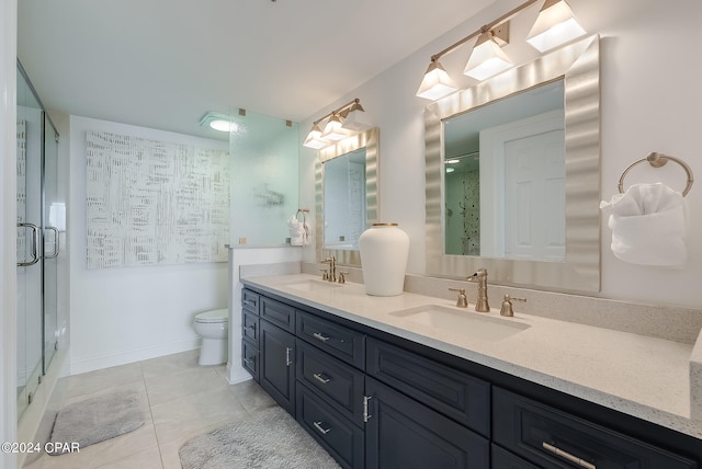 bathroom with tile patterned flooring, an enclosed shower, toilet, and dual vanity