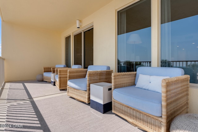 exterior space featuring outdoor lounge area and a balcony