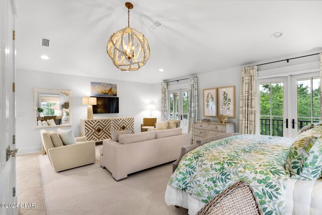 bedroom featuring access to exterior, french doors, light tile patterned flooring, and a notable chandelier