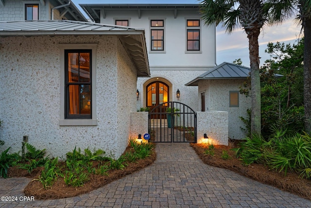 exterior entry at dusk with french doors