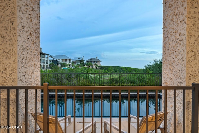 balcony featuring a water view