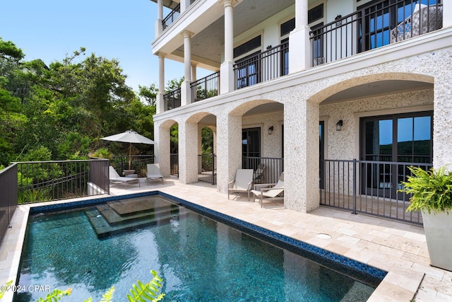 view of swimming pool with a patio