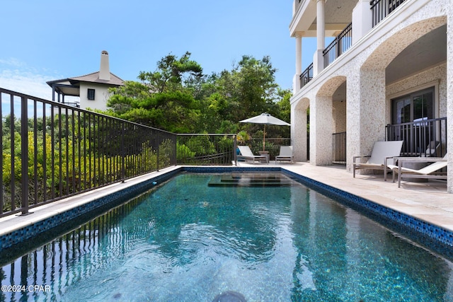 view of pool featuring a patio area