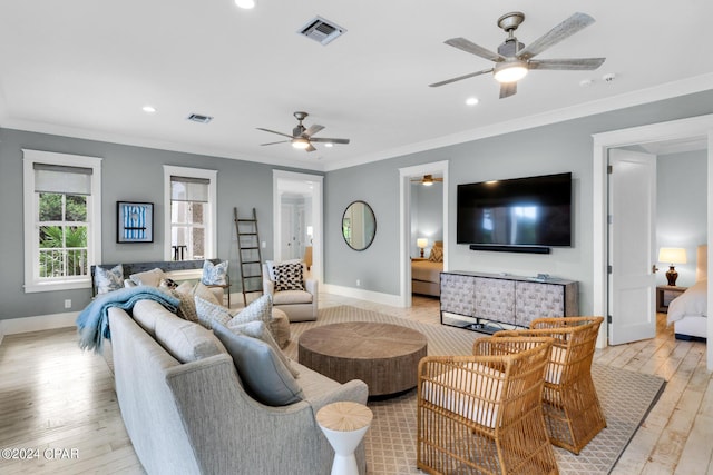 living room with ceiling fan, light hardwood / wood-style floors, and ornamental molding