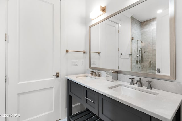 bathroom with a shower with door and vanity