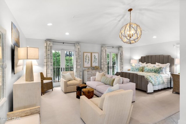 bedroom with access to exterior, french doors, multiple windows, and a notable chandelier