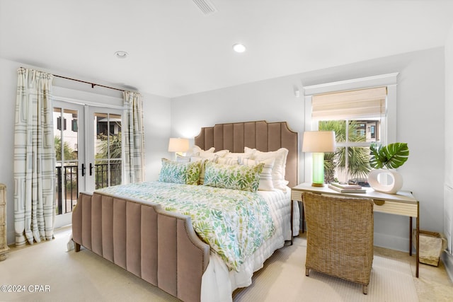 carpeted bedroom with access to outside and french doors