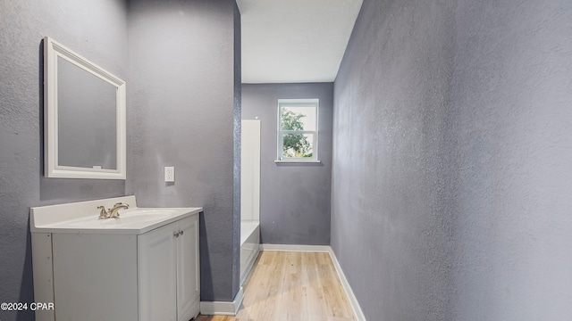 bathroom featuring vanity and wood-type flooring