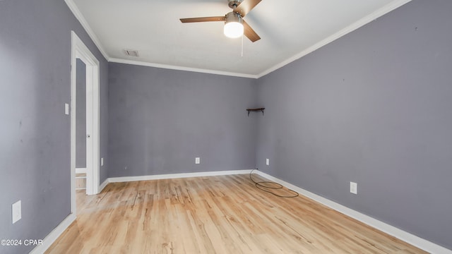 unfurnished room with ceiling fan, light wood-type flooring, and crown molding