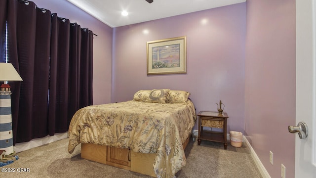 carpeted bedroom featuring ceiling fan