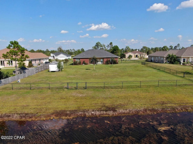 view of yard with a rural view