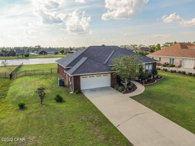 ranch-style house with central AC unit, a garage, and a front lawn