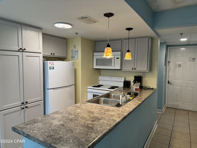 kitchen with sink, tile patterned floors, gray cabinets, and white appliances