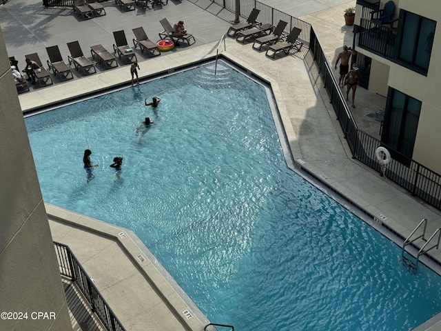 view of pool featuring a patio