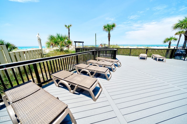 wooden deck featuring a water view