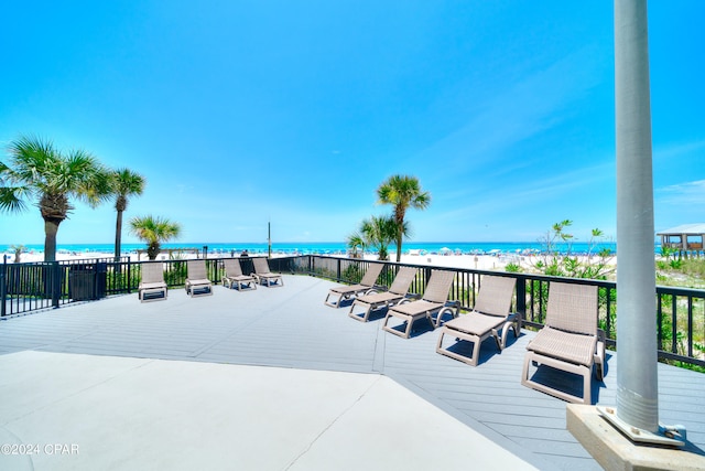 wooden deck featuring a water view