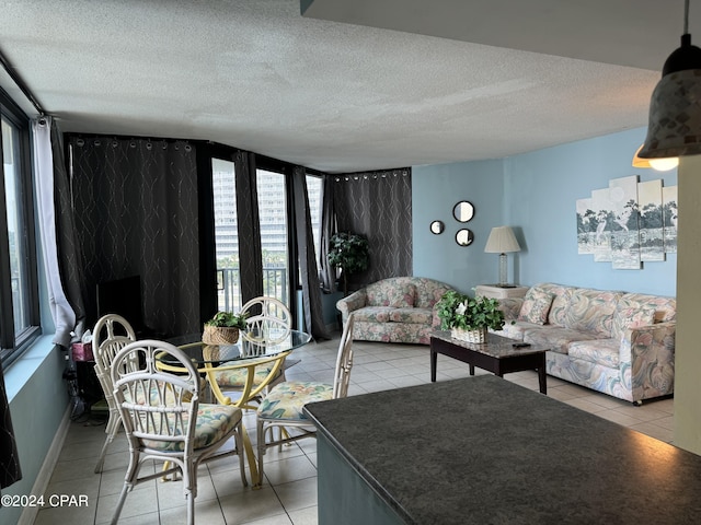 living room with light tile patterned floors and a textured ceiling