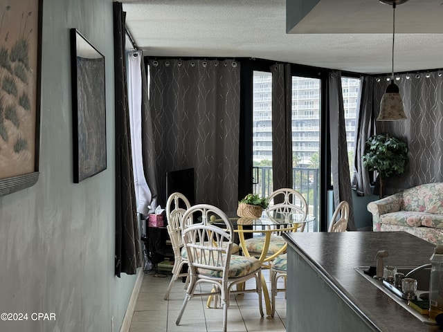 dining space featuring a textured ceiling