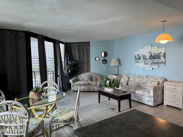 tiled living room featuring a textured ceiling