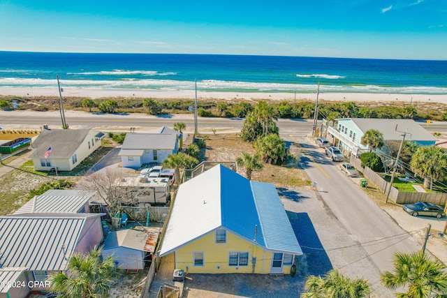 drone / aerial view with a water view and a view of the beach