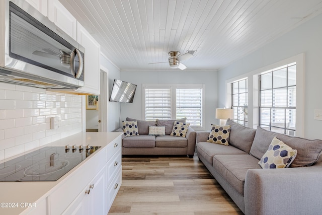 living room with ceiling fan, wooden ceiling, and light wood-type flooring