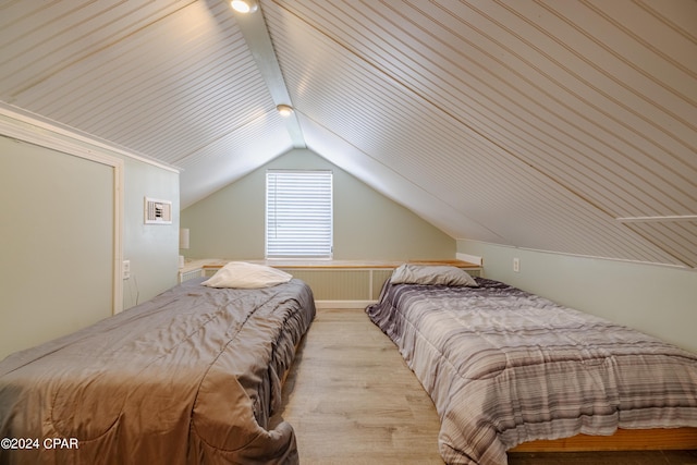 bedroom featuring lofted ceiling