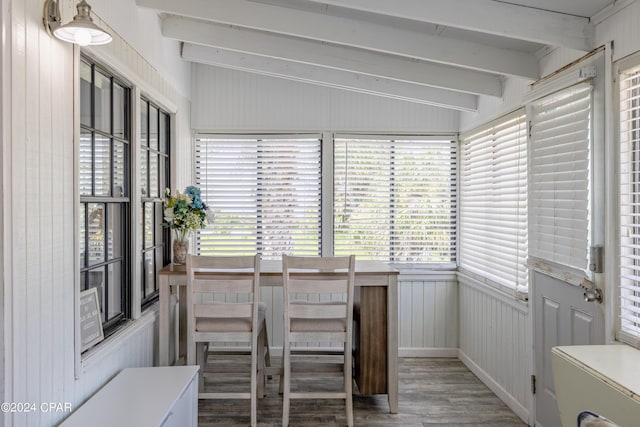 sunroom with lofted ceiling with beams