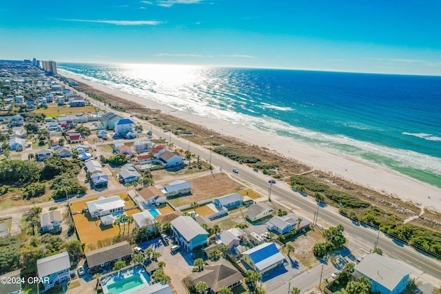 bird's eye view featuring a beach view and a water view