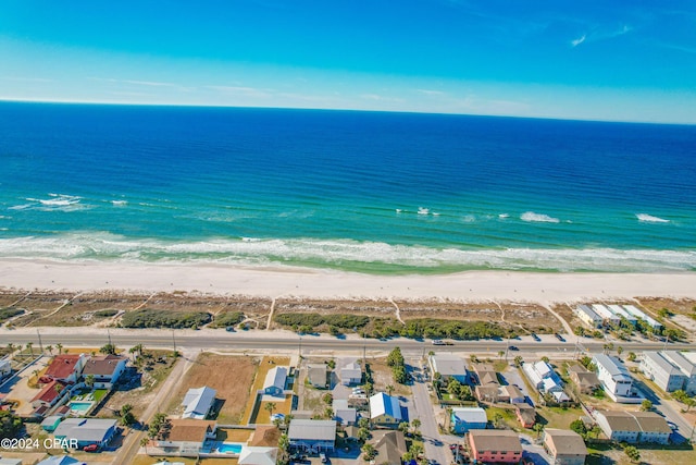 birds eye view of property with a beach view and a water view