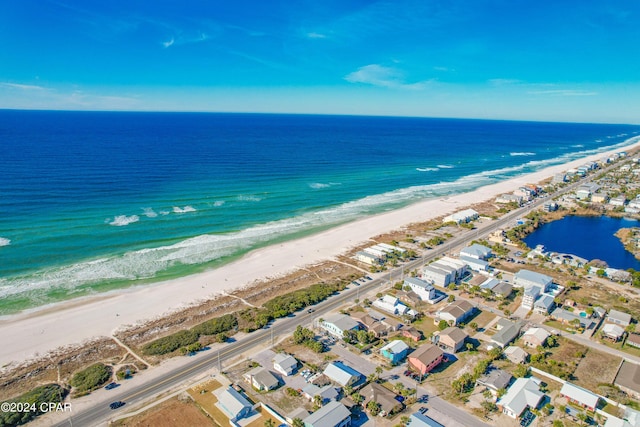 bird's eye view featuring a water view and a view of the beach