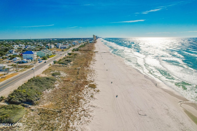 bird's eye view with a water view and a view of the beach