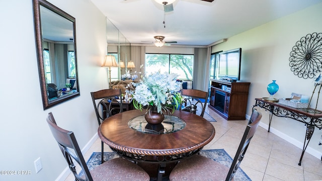 tiled dining room with ceiling fan