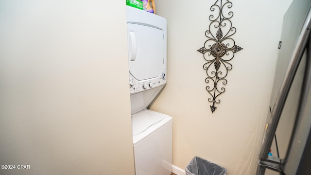 clothes washing area with stacked washer / drying machine